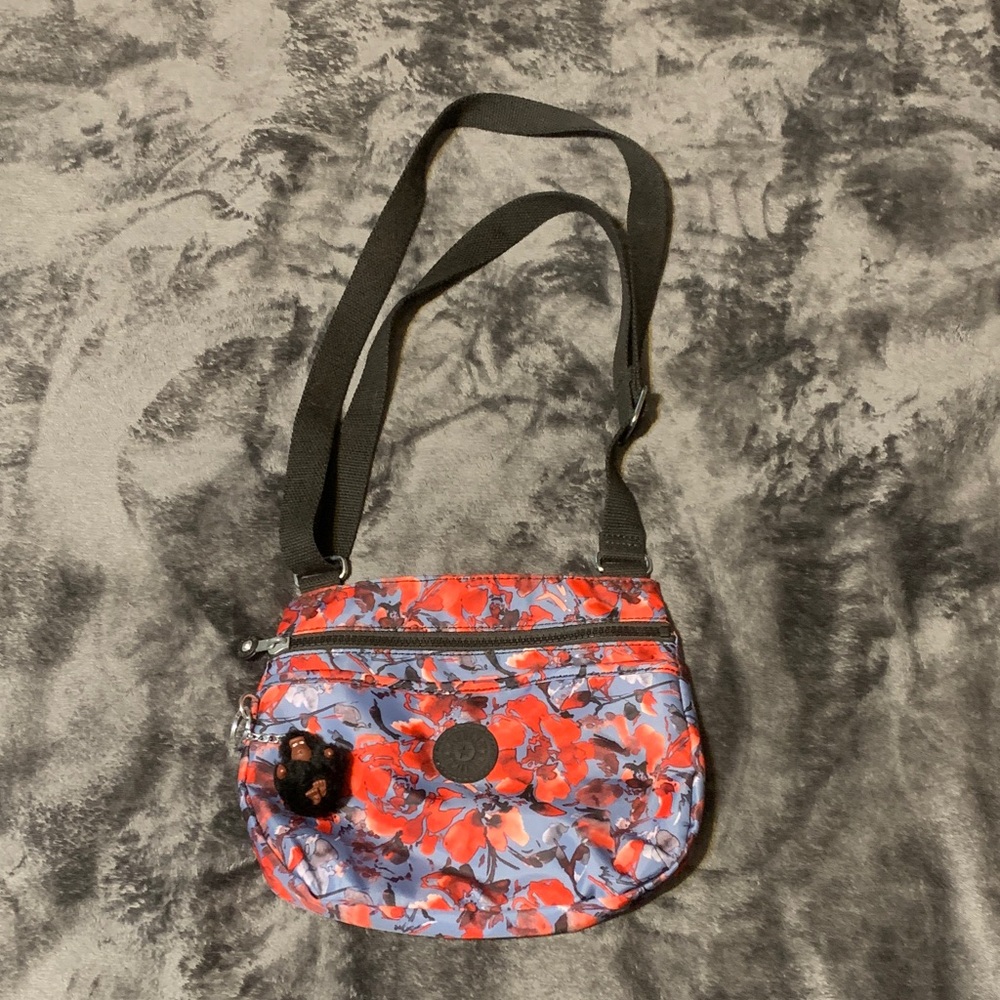 KIPLING- Floral Crossbody Bag - Red/Blue/Black with the Iconic Monkey Keychain.